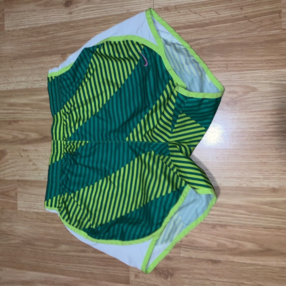 Green and white nike shorts.